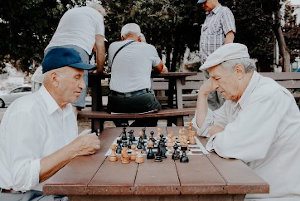 A group of men playing chess.